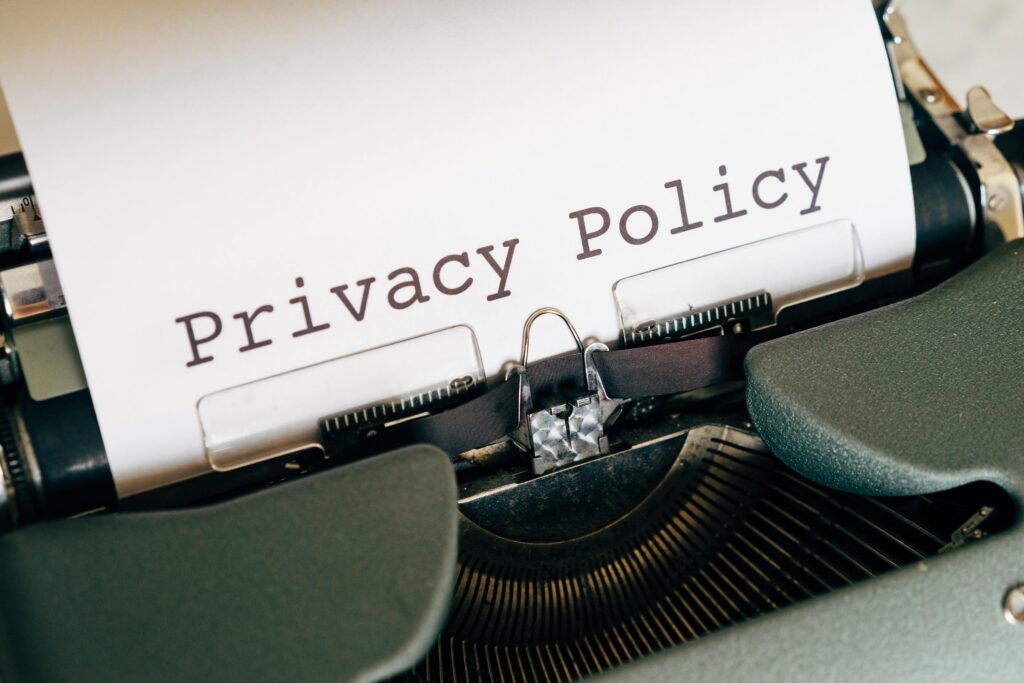 pexels photo 4152513 4152513 A vintage typewriter writing 'Privacy Policy' on paper, capturing an old-school conceptual theme.